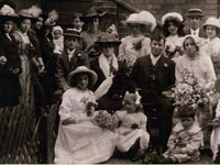 Margaret is standing far left with the black hat with white centre, her sister Minnie is seated far right under the gentleman with the moustache in her pretty bonnet. The children sitting in front of the bride & groom are Mabel and Bernard Pearson.